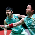 Singapore Open Title Defense featuring Aaron Chia and Soh Wooi Yik defending a low shot.