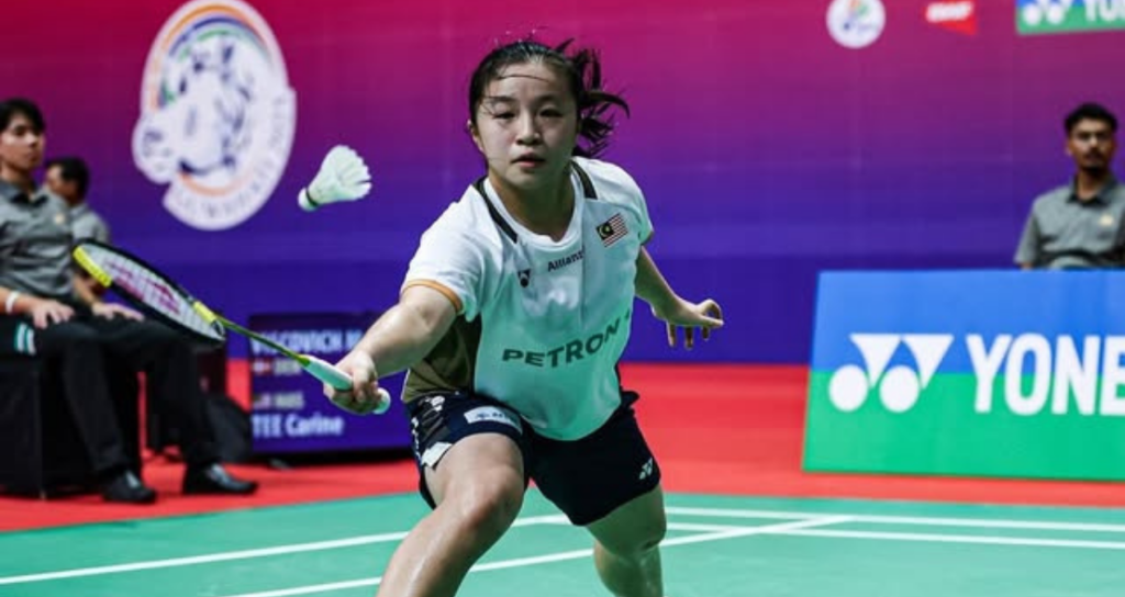 Junior Mixed Team Championship featuring Carine Tee in high-intensity action during a match.