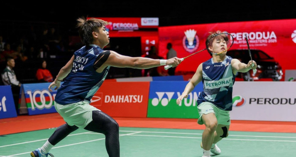 World Rankings Decline context showing a rising Malaysian doubles pair in action.