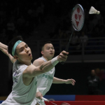 BWF World Rankings Shift context featuring Aaron Chia and Soh Wooi Yik defending a low shot.