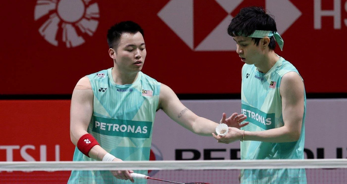 BWF Japan Open Reshuffle context showing Aaron Chia and Soh Wooi Yik during a match.