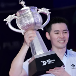 June Wei Taiwan Open showing Cheam June Wei holding the giant silver Lin Dan Cup trophy after his victory.