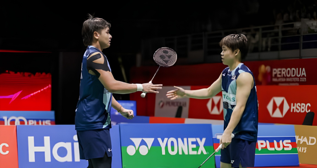 Aaron-Khai Xing upset showing Aaron Tai and Kang Khai Xing competing on the green court during the Japan Open.