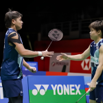 Aaron-Khai Xing upset showing Aaron Tai and Kang Khai Xing competing on the green court during the Japan Open.
