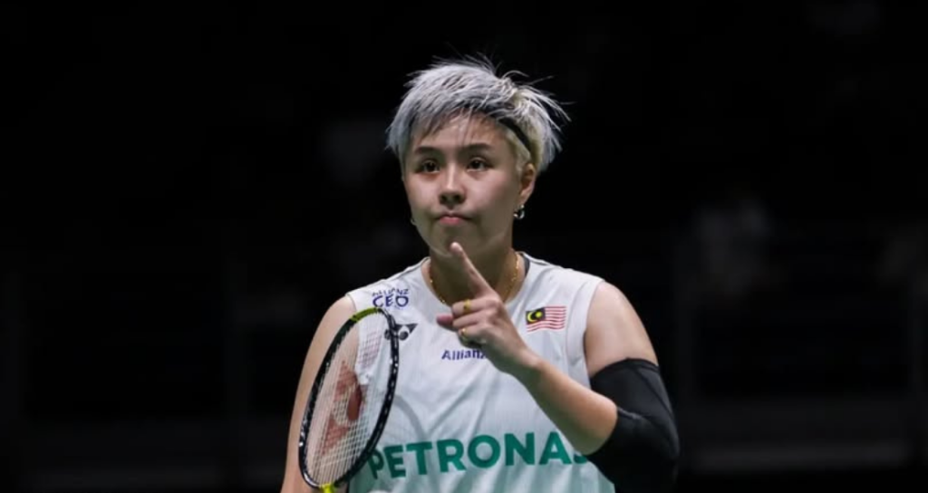 Ee Wei Rehabilitation Process showing Toh Ee Wei with short silver hair gesturing with her index finger on court.