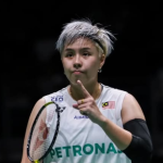 Ee Wei Rehabilitation Process showing Toh Ee Wei with short silver hair gesturing with her index finger on court.