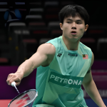 Justin Hoh Taiwan Open showing Justin Hoh poised to return the shuttlecock during first round action.