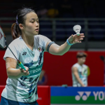Ling Ching China Open showing Wong Ling Ching holding the shuttlecock to serve.