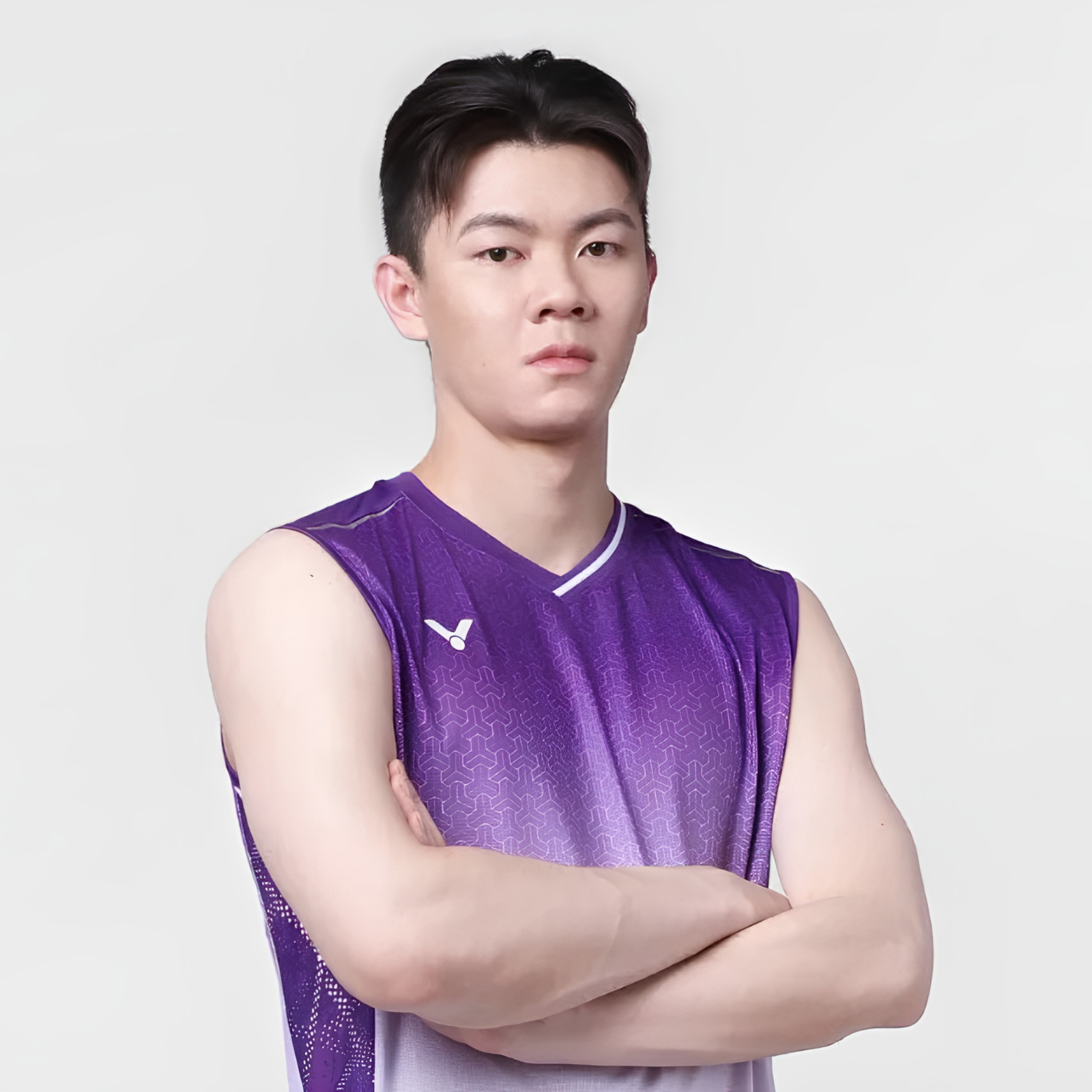 Lee Zii Jia professional badminton profile image showing the Malaysian singles star posing with arms crossed against a white studio background.