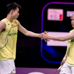 Aaron-Wooi Yik Future showing Aaron Chia and Soh Wooi Yik touching hands on the green court.