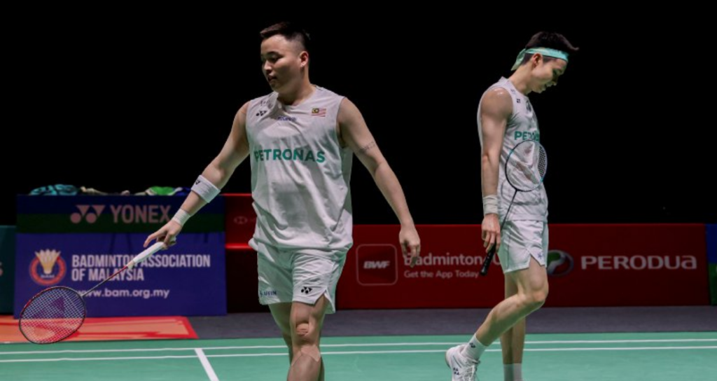Aaron-Wooi Yik Future showing Aaron Chia and Soh Wooi Yik looking pensive on court in Kuala Lumpur.