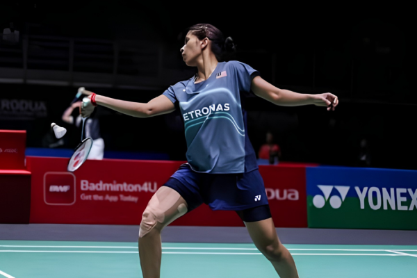 Letshanaa World Championships showing K Letshanaa executing a deep lunge on the green court.
