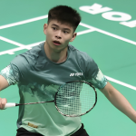 BWF World Championships 2026 showing Leong Jun Hao poised to return the shuttlecock during first round action.