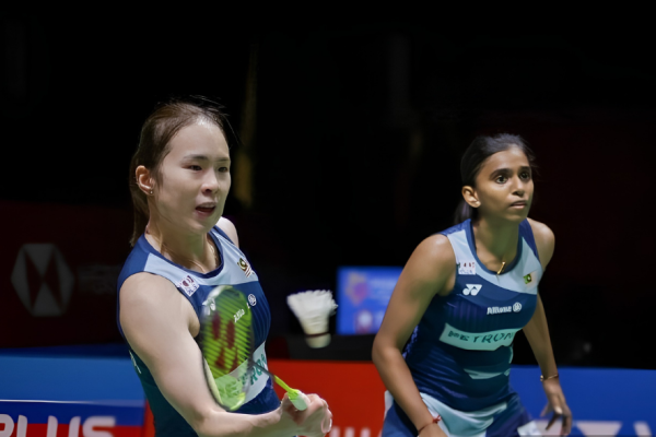 Pearly-Thinaah showing Pearly Tan and M Thinaah playing together on court in New Delhi.
