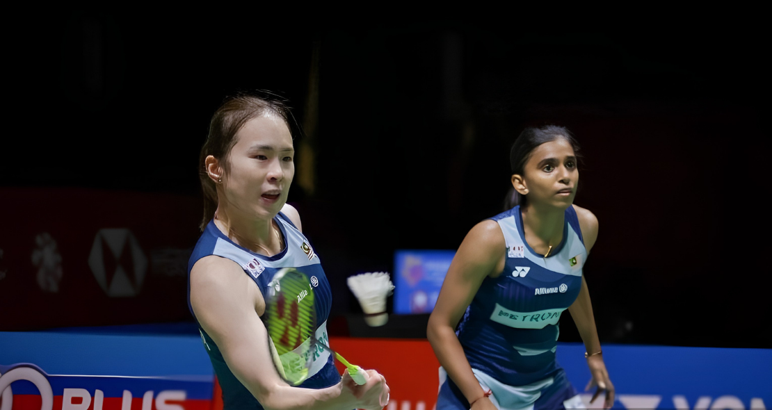 Pearly-Thinaah showing Pearly Tan and M Thinaah playing together on court in New Delhi.