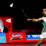 Pearly-Thinaah Taiwan Final showing M Thinaah lunging forward to return the shuttlecock with Pearly Tan watching.