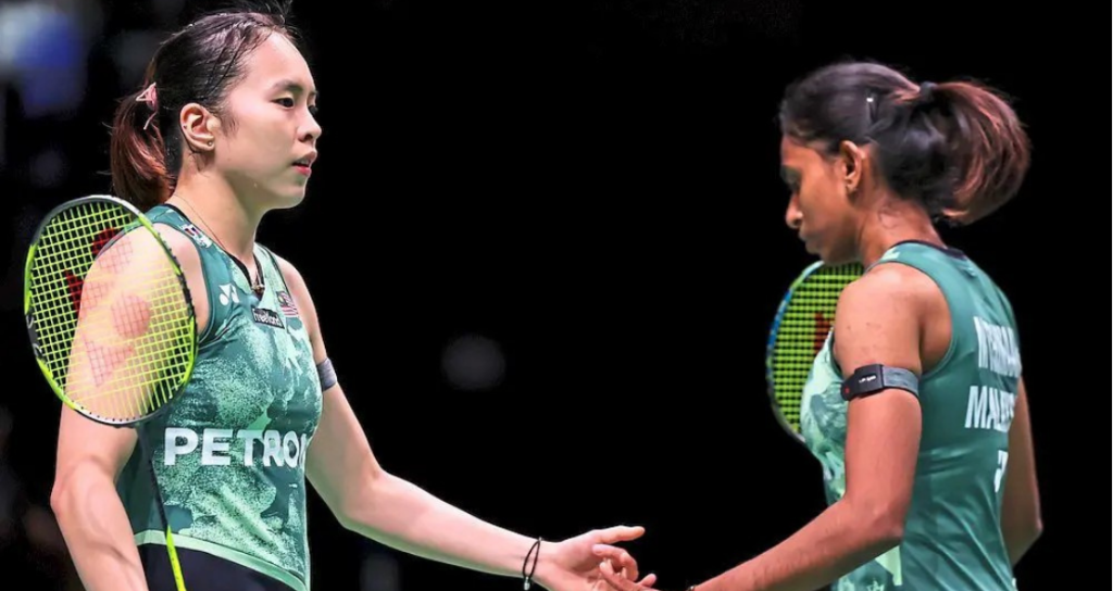 Pearly Tan Injury Recovery showing Pearly Tan and M Thinaah connecting on the green court.