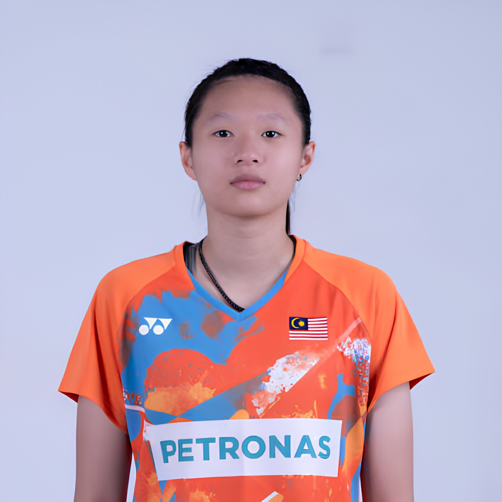 Nicole Chau Xuan professional badminton profile image showing the Malaysian Women's Double player smiling