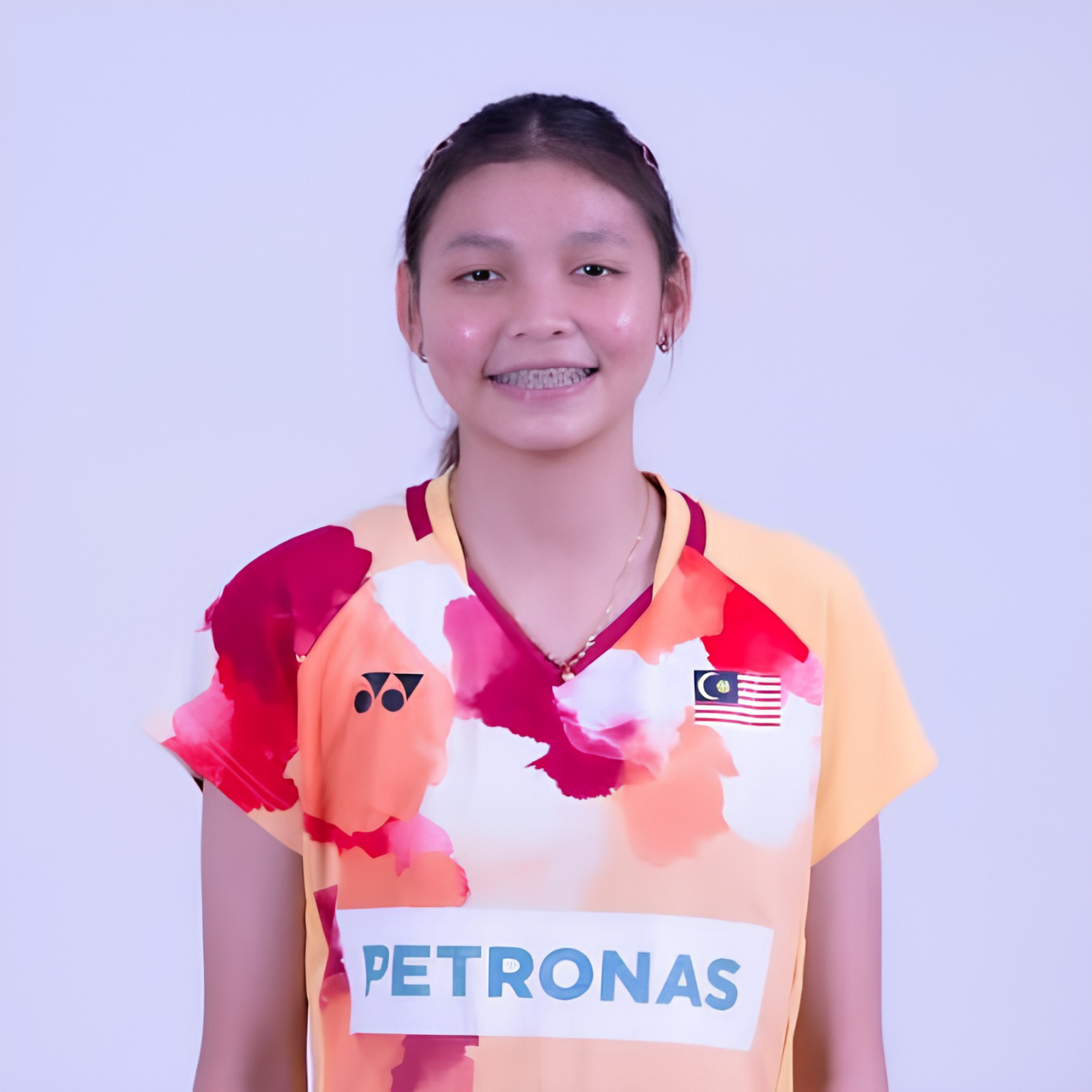 Shaneesa Shahidi professional badminton profile image showing the Malaysian singles player smiling against a white studio background.