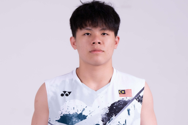 Tan Zhi Yang professional badminton profile image showing the Malaysian Men's Double player smiling