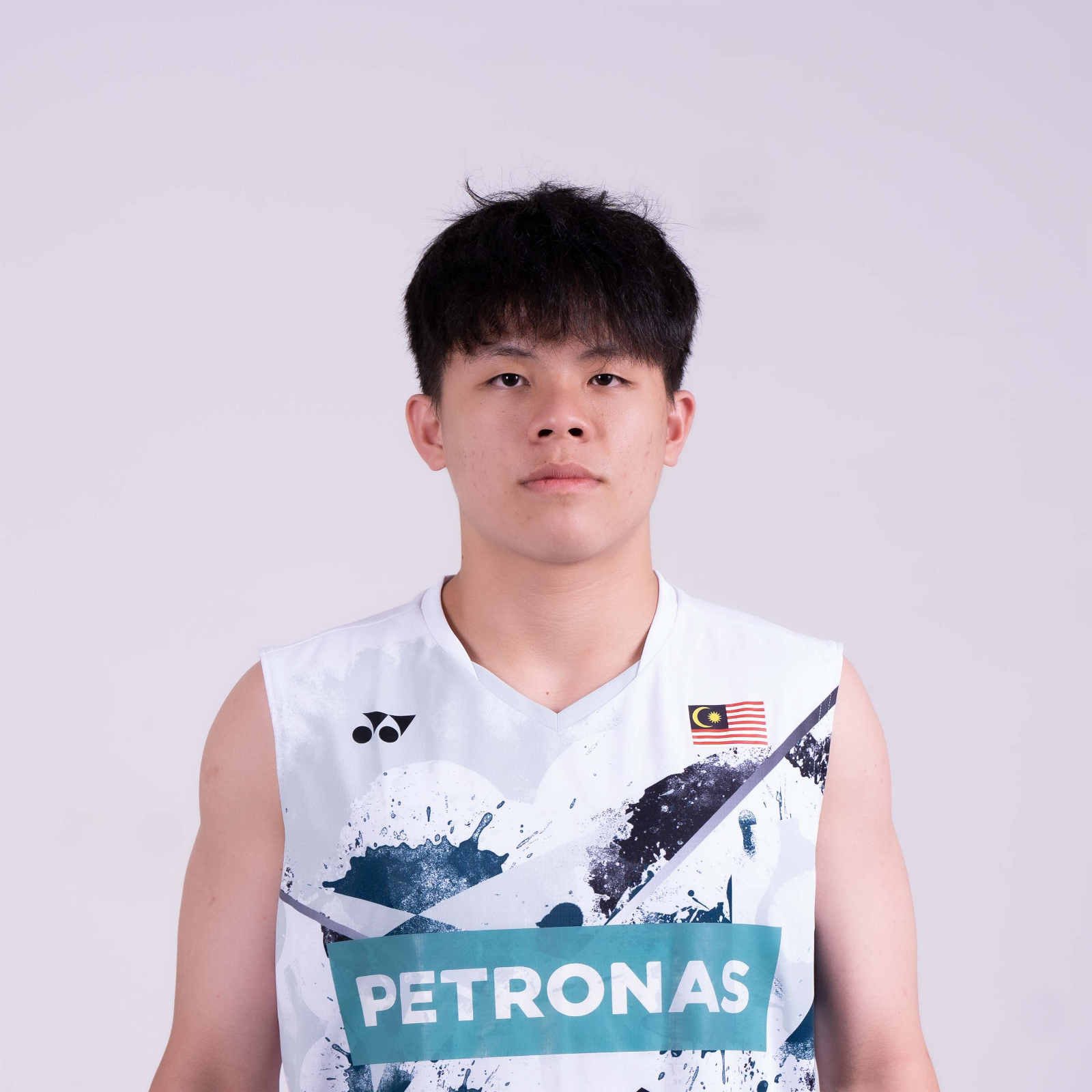 Tan Zhi Yang professional badminton profile image showing the Malaysian Men's Double player smiling