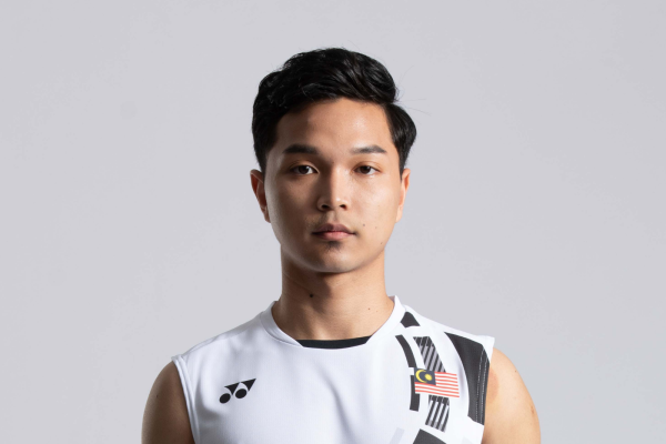Wan Arif Wan Junaidi professional badminton profile image showing the Malaysian Men's Double player smiling