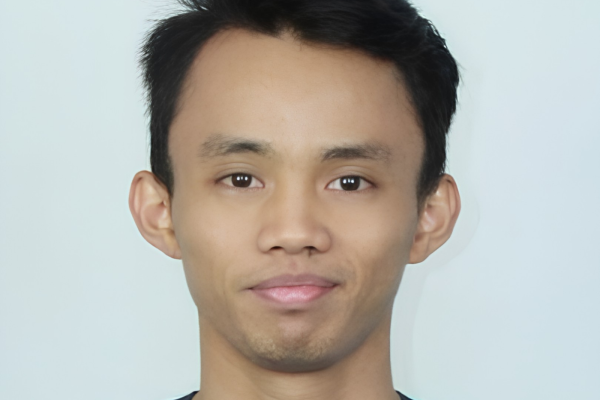 Aidil Sholeh Ali Sadikin professional badminton profile image showing the Malaysian singles star posing with arms crossed against a white studio background.
