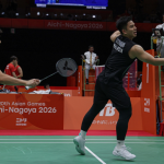 Nur Izzuddin Rumsani executes a forehand net tap while Goh Sze Fei stays ready during the Asian Games men's doubles match.