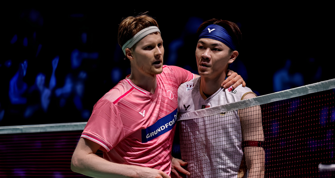 Anders Antonsen embraces Lee Zii Jia at the net following their Arctic Open semifinal match.