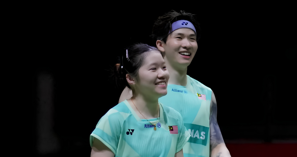 Chan Wen Tse and Chen Tang Jie smile on court in their mint green Malaysian national jerseys during the Arctic Open.
