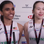 M. Thinaah and Pearly Tan smile during a media interview in their white Petronas jerseys at the Denmark Open.